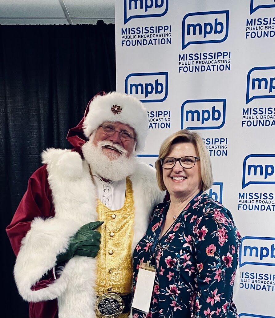 Santa Sarge with a guest at a Mississippi Public Broadcasting Foundation event