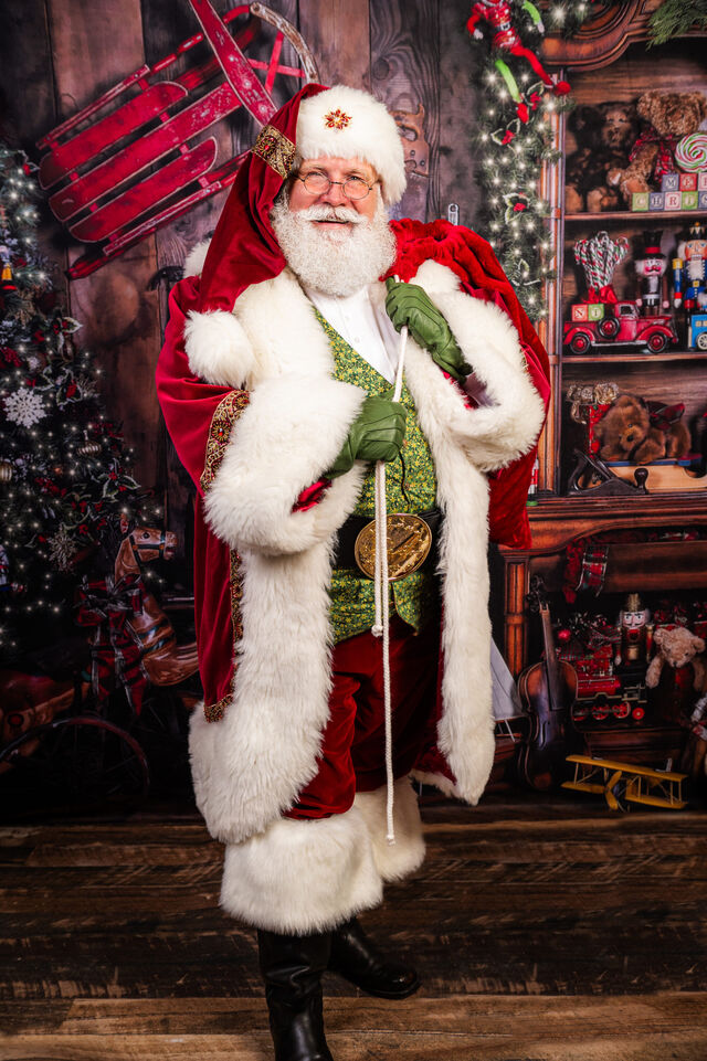 Full-length portrait of Santa Sarge in his workshop