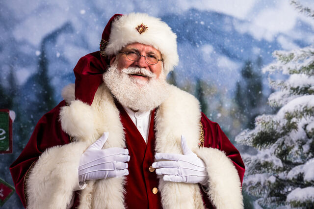Santa Sarge in white gloves in a snowy forest